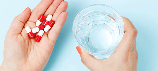 Capsules en water