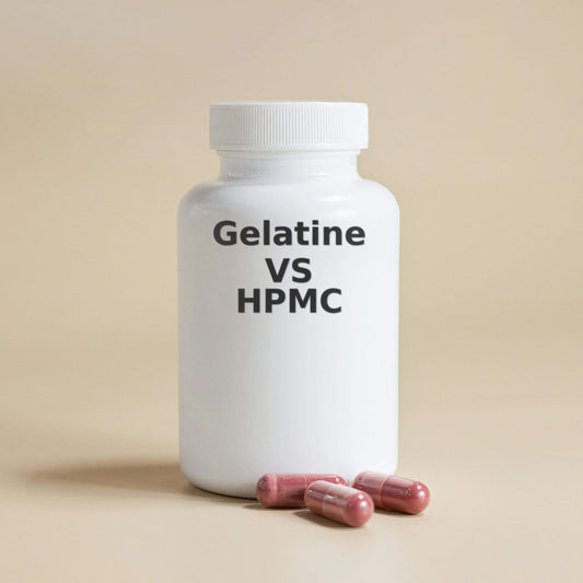 White plastic supplement bottle with black text reading 'Gelatine VS HPMC', with three pink capsules placed in front of it on a beige background.